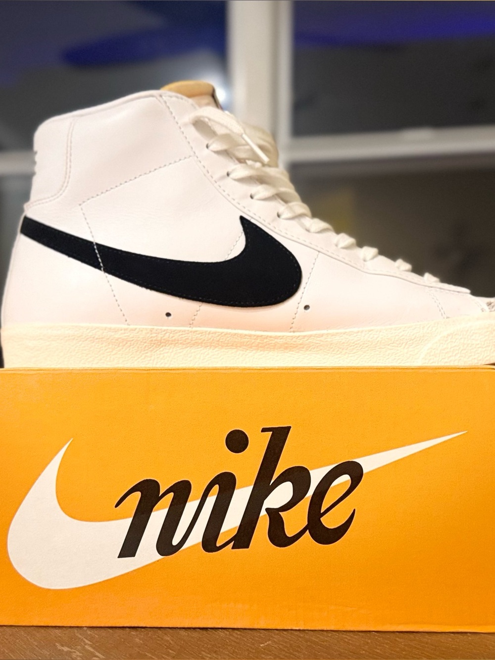 Nike Men’s White High-Top Sneakers with Black Swoosh